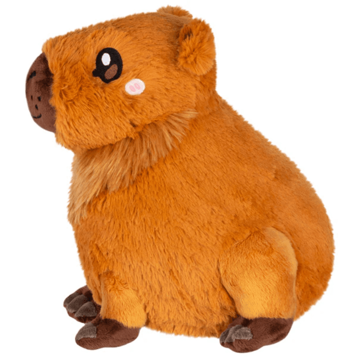 Mini Squishable Capybara plush toy side view showing rounded body and fluffy fur on a white background