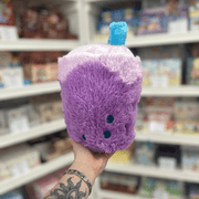 Mini Squishable Comfort Food Bubble Tea plush toy held in hand, side back view showing blue straw