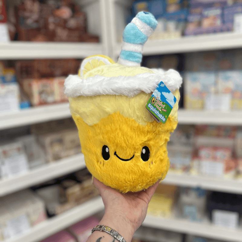 Mini Squishable Comfort Food Lemonade plush toy held in hand, front view with tag visible
