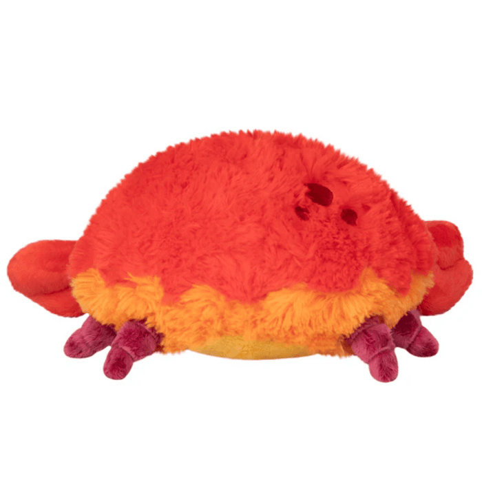Back view of Mini Squishable Crab plush toy showing fluffy red and orange fabric