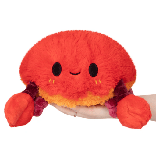 Front view of Mini Squishable Crab plush toy with smiley face