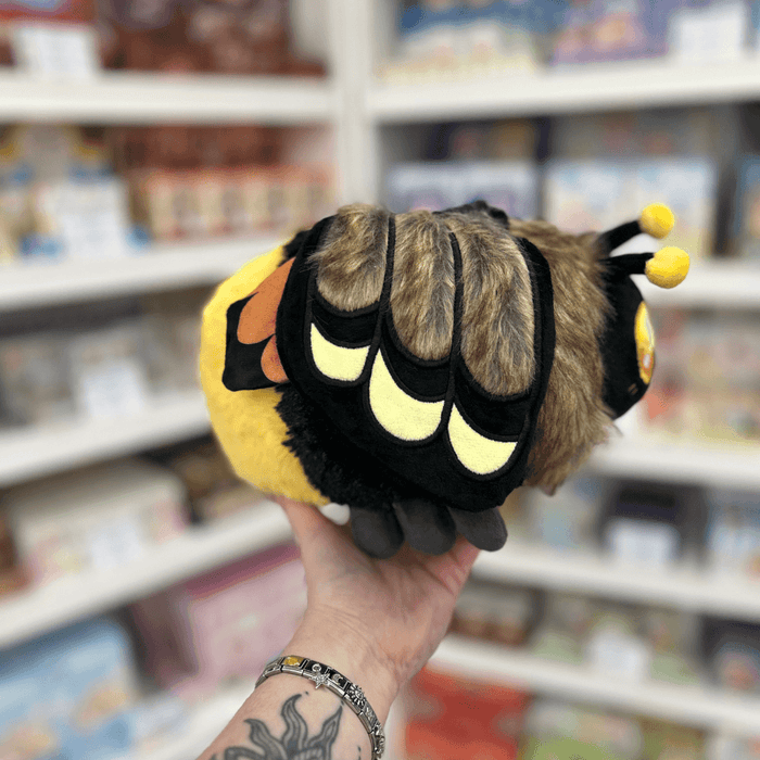 Mini Squishable Death's-head Hawkmoth plush toy held in hand showing wing detail