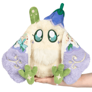 Mini Squishable Fairy Baby Mothman Plush held in hand with wings open and floral fairy details