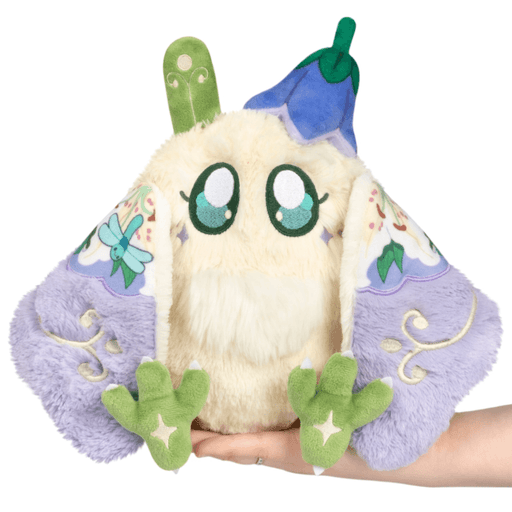 Mini Squishable Fairy Baby Mothman Plush held in hand with wings open and floral fairy details