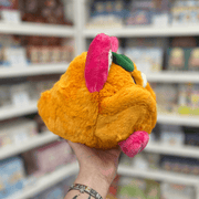 Mini Squishable Fruit Bat plush toy held in hand, back view