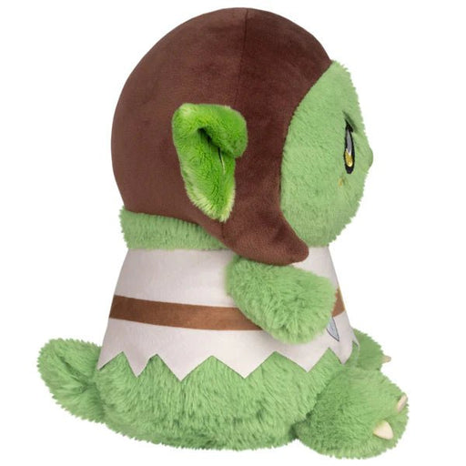 Side view of Mini Squishable Goblin plush toy with oversized ear, brown hood and green fluffy body.