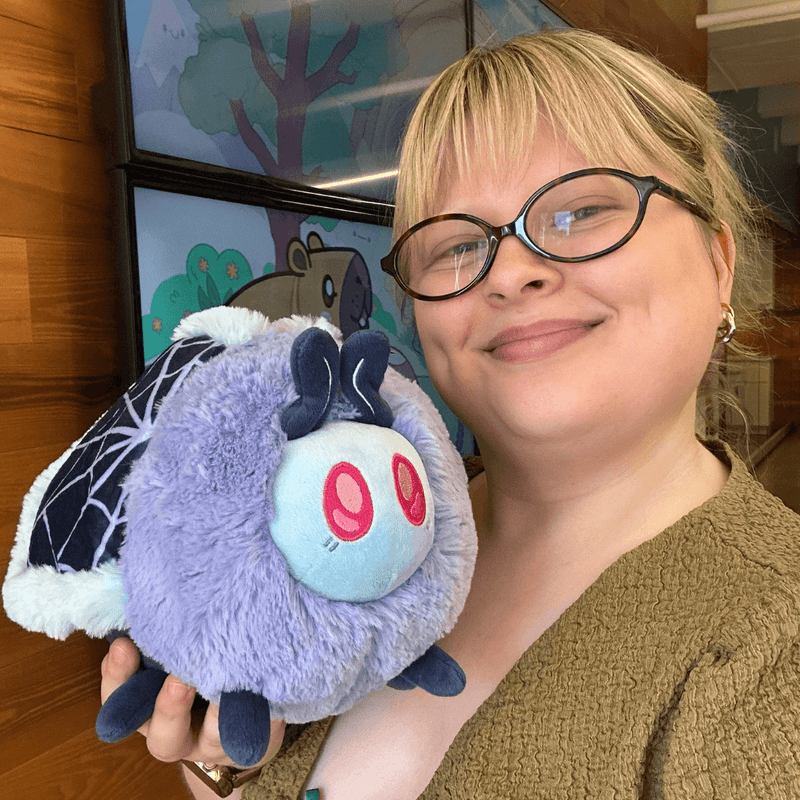Mini Squishable Haunted Moth plush being held to show its size