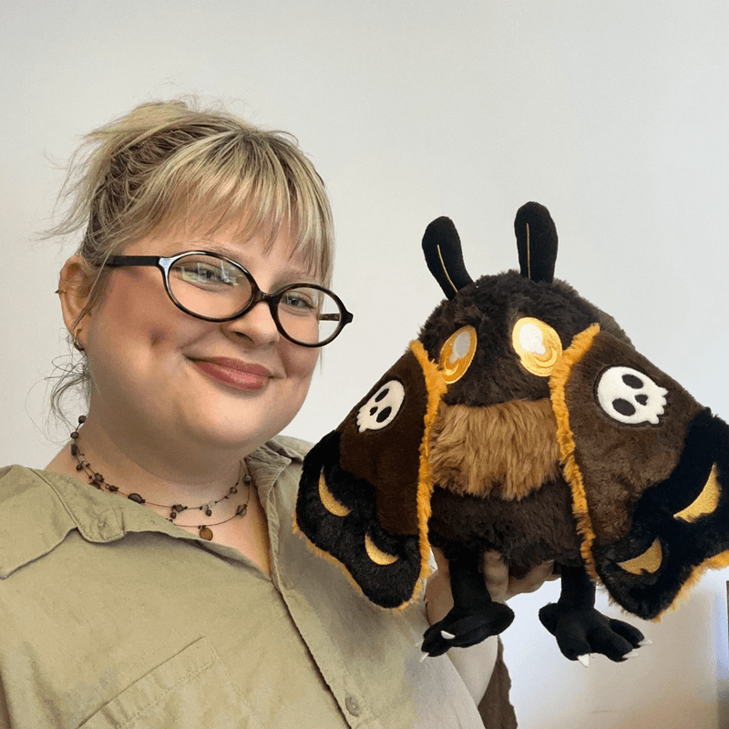 Mini Squishable Hawkmothman plush being held