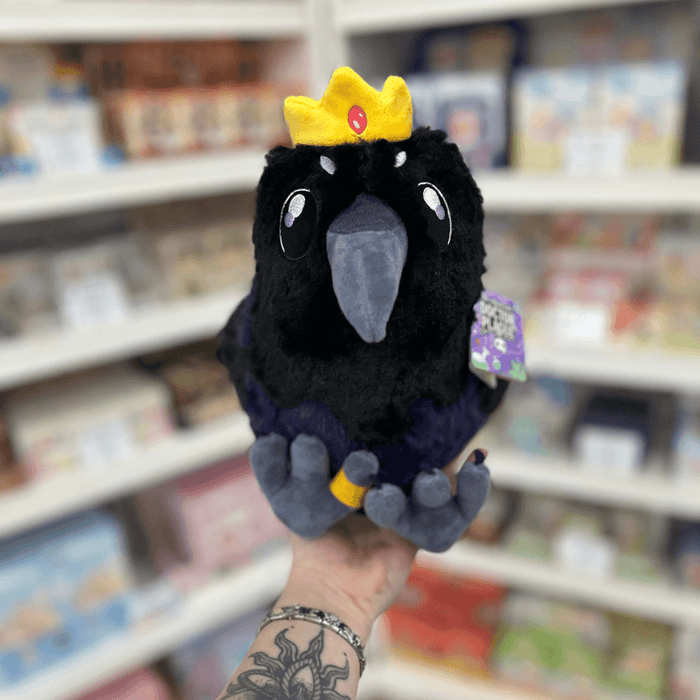 Mini Squishable King Raven plush toy held in hand, front view
