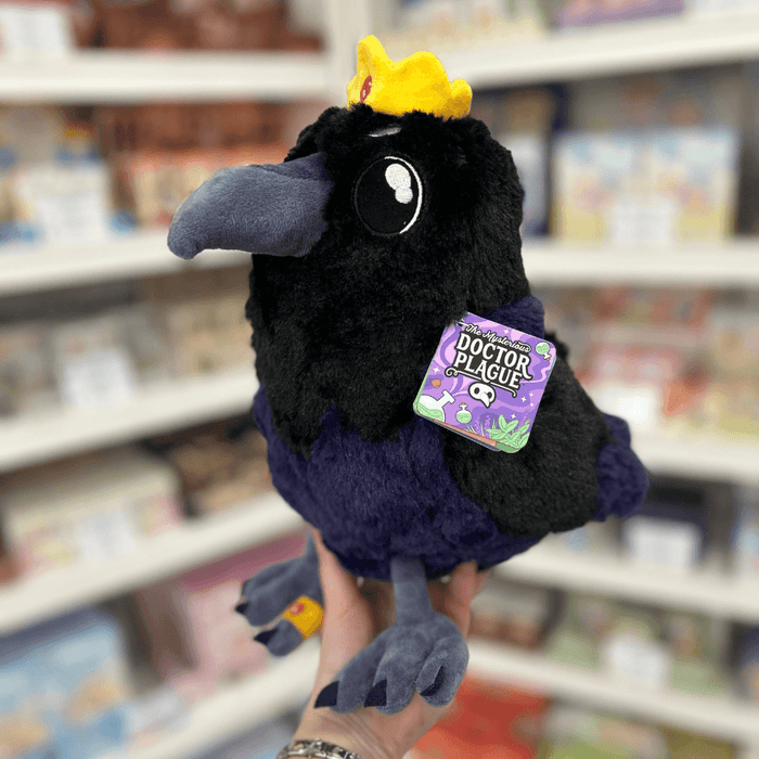 Mini Squishable King Raven plush toy held in hand with tag visible