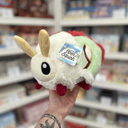 Mini Squishable Luna Moth plush toy held in hand angled side view
