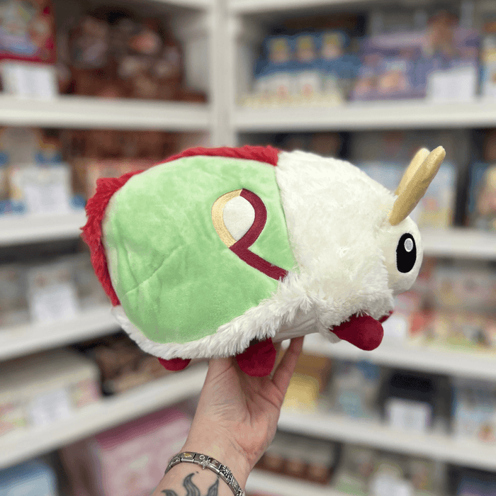 Mini Squishable Luna Moth plush toy held in hand side view