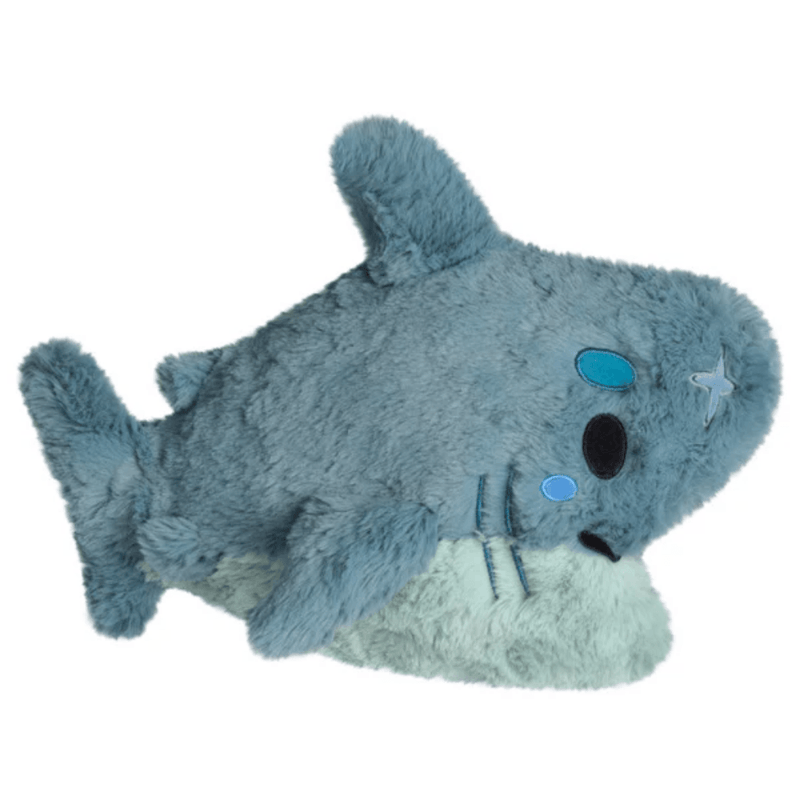 Side view of the Mini Squishable Megalodon plush toy showing fins and tail