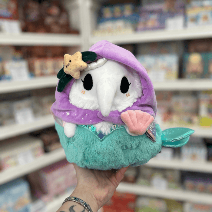 Mini Squishable Mermaid Plague Nurse plush toy held in hand, front view