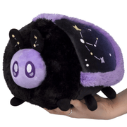 Mini Squishable Midnight Moth plush with a black body and purple celestial wings
