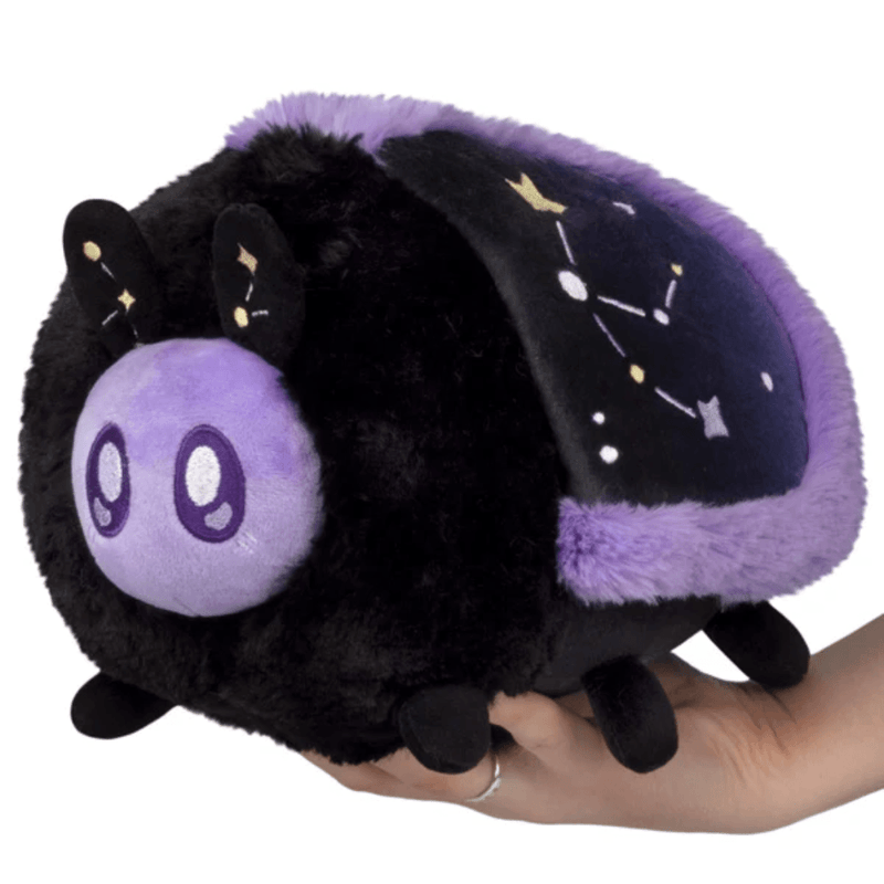 Mini Squishable Midnight Moth plush with a black body and purple celestial wings