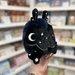 Mini Squishable Midnight Mothman plush toy held in hand showing moon and star wing detail