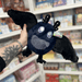 Mini Squishable Midnight Mothman plush toy held in hand with wings spread