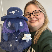 Mini Squishable Midnight Plague Doctor plush being held