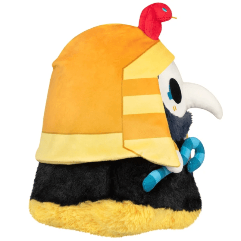 Side view of Squishable Pharaoh Plague Doctor plush showing its striped Egyptian headdress and blue staff