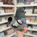 Mini Squishable Pigeon plush toy held in hand, side view