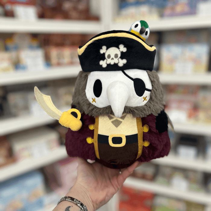 Mini Squishable Pirate Plague Doctor plush toy held in hand, front view
