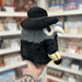 Mini Squishable Plague Doctor plush toy held in hand, side view