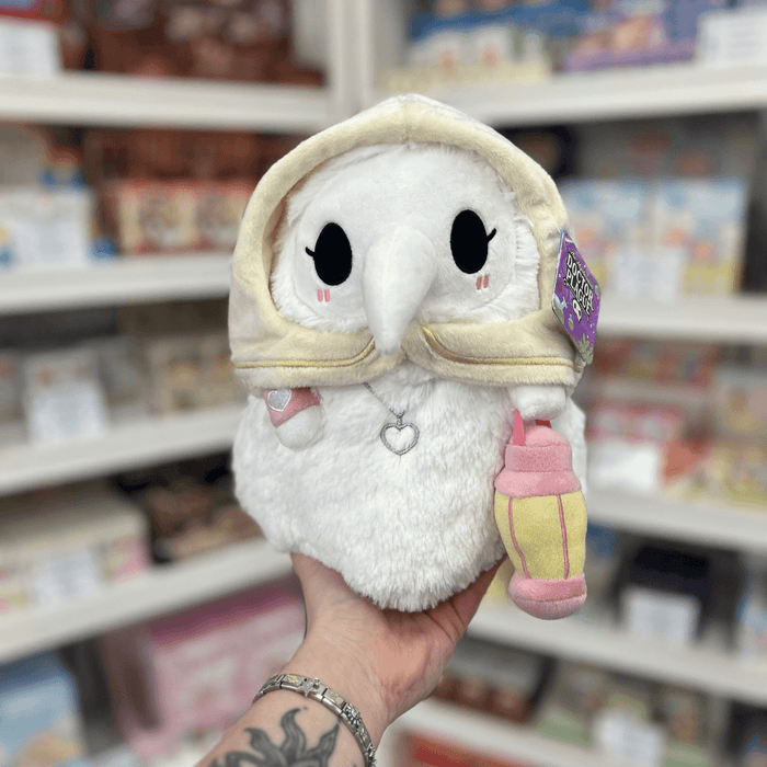 Mini Squishable Plague Nurse plush toy held in hand, front view