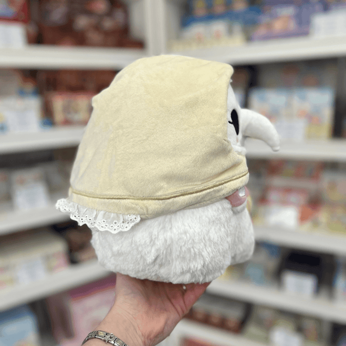 Mini Squishable Plague Nurse plush toy held in hand, side view