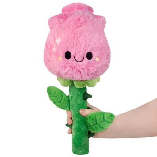 Mini Squishable Rose plush toy with pink fluffy rosebud face and green stem, held in hand