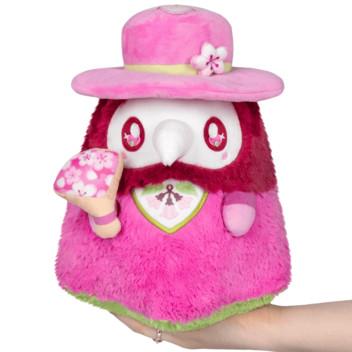 Front view of Mini Squishable Sakura Doctor Plague Plush with pink outfit, blossom hat and sakura fan