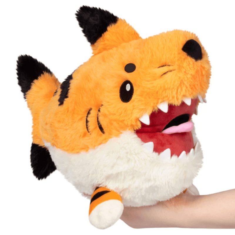 Front view of the Mini Squishable Tiger Shark plush toy with orange fur, teeth and pink tongue