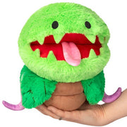 Mini Squishable Venus Flytrap plush toy with green leaves and smiling mouth