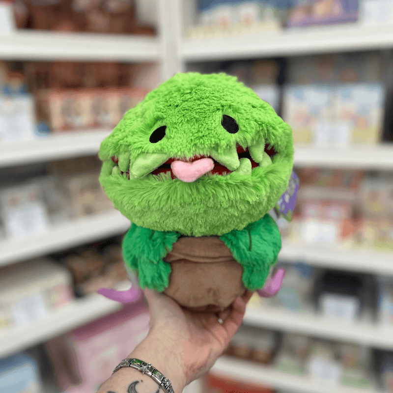 Mini Squishable Venus Flytrap plush toy held in hand, front view