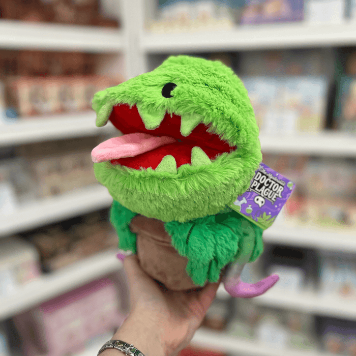 Mini Squishable Venus Flytrap plush toy held in hand with tag visible