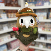 Mini Squishable Woodland Plague Doctor plush toy held in hand, front view