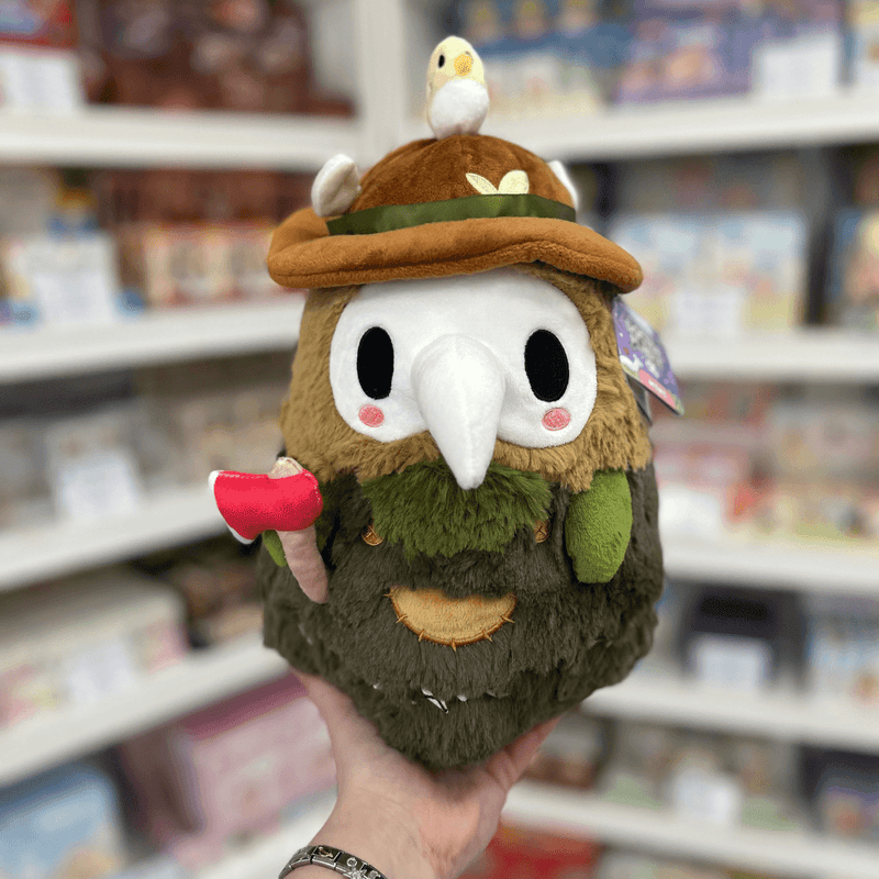 Mini Squishable Woodland Plague Doctor plush toy held in hand, front view
