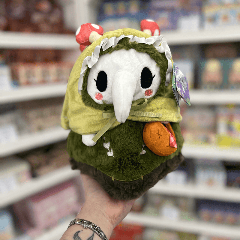 Mini Squishable Woodland Plague Nurse plush toy held in hand, front view