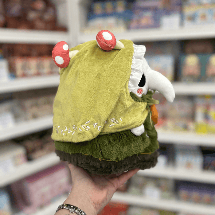 Mini Squishable Woodland Plague Nurse plush toy held in hand, side view