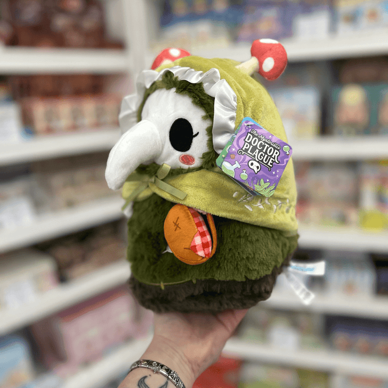 Mini Squishable Woodland Plague Nurse plush toy held in hand with tag visible