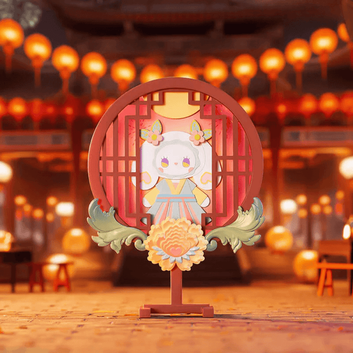 EMMA Lantern Festival Fireworks figure with round red lantern frame and peony base, night market backdrop.