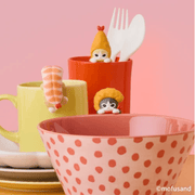 Shrimp Meow HIPPERS figures displayed around a mug and bowl