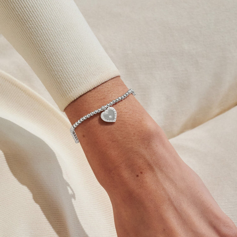 Silver-plated Joma Jewellery beaded Bracelet worn on wrist with sparkly heart charm and tiny star detail, Like A Mum To Me gift.