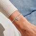 Silver-plated Joma Jewellery beaded Bracelet worn on wrist with sparkly heart charm, Mother’s Day gift for Mum.