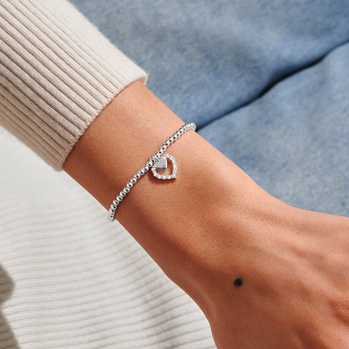 Silver-plated Joma Jewellery beaded Bracelet worn on wrist with crystal heart halo charm, Love You Mummy Mother’s Day gift.