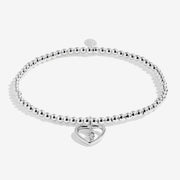 Full view of Joma Jewellery A Little Mums Are Angels In Disguise Bracelet, silver-plated beaded stretch Bracelet with heart and feather charm.