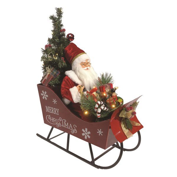60cm Musical Santa in a red sleigh with tree, gifts and greenery, white background.