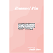 White enamel pin with black text reading my “people skills” are “rusty”, displayed on a pink backing card.