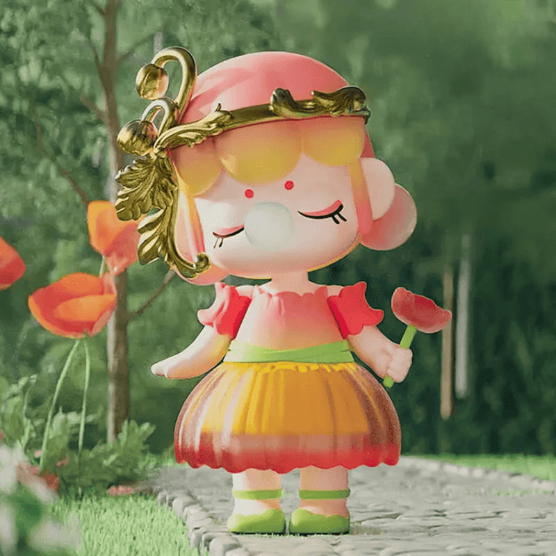 Corn Poppy figure, coral‑rose hat and ombré skirt holding poppy bud
