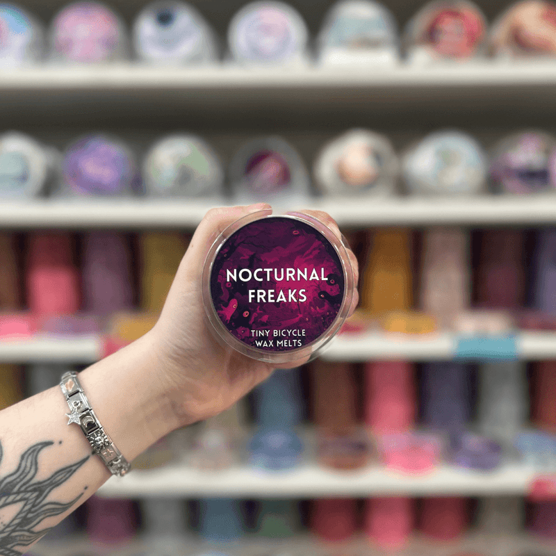 Nocturnal Freaks wax melt pot with dark purple label